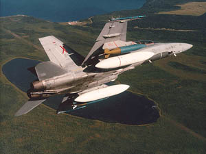 A F/A-18 loaded with ground attack ordnance