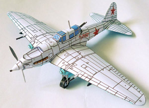 A winter camo Il-2 standing on a white background