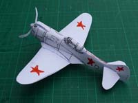 A La-5 with black panel lines on the fuselage and red stars on the wings