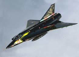 A all-black Draken with yellow slats and a yellow dragon on the nose